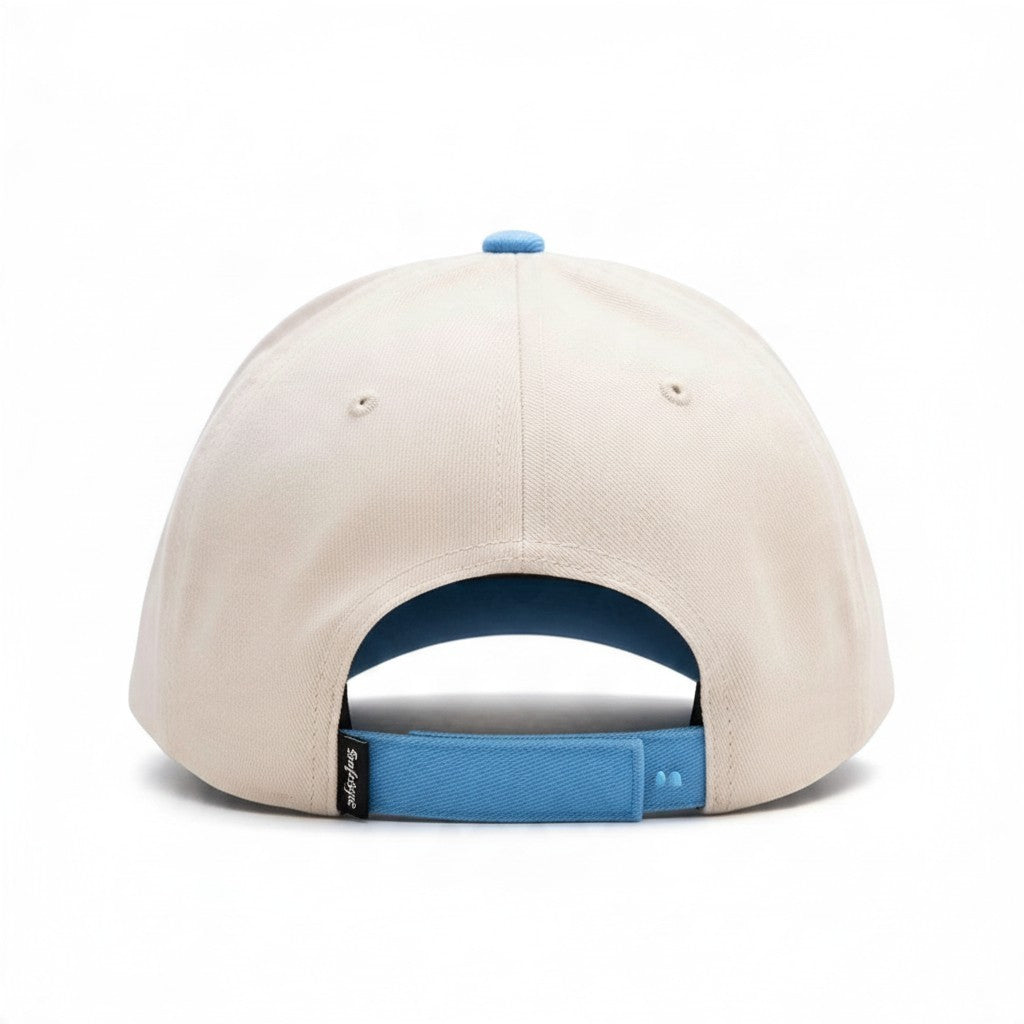 Dirty Merch Apparel beige and blue adjustable trucker hat with a low profile back view