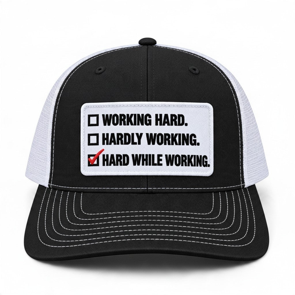 Dirty Merch Apparel black and white trucker hat with embroidered Hard While Working checklist patch