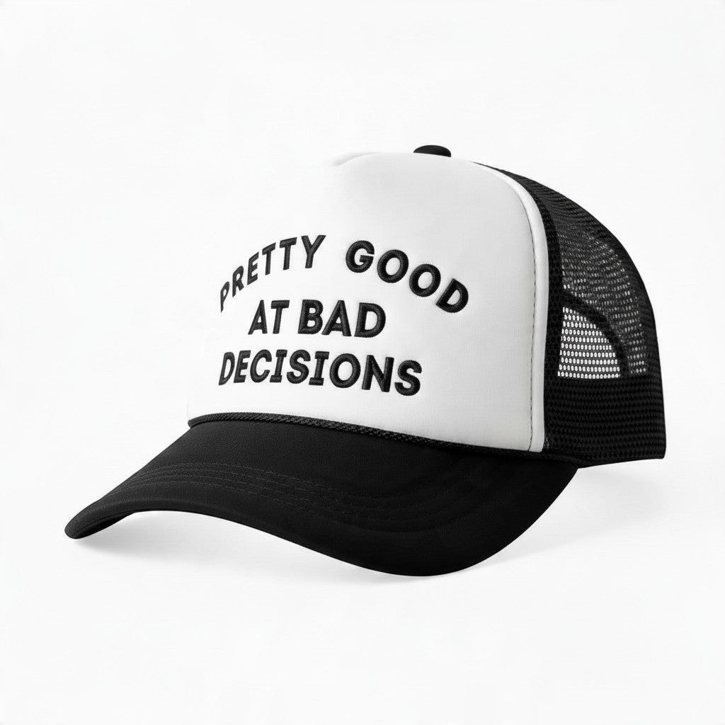 Dirty Merch Apparel white foam trucker hat with black brim, mesh back, and Pretty Good at Bad Decisions embroidery.