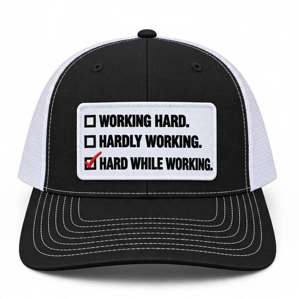 Dirty Merch Apparel black and white trucker hat with embroidered Hard While Working checklist patch