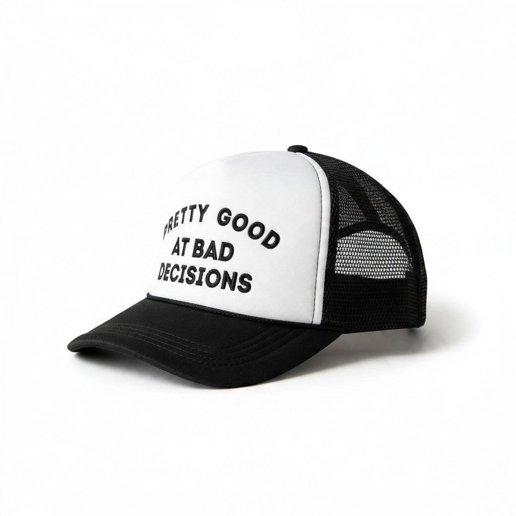 Dirty Merch Apparel black and white trucker hat with embroidered Pretty Good at Bad Decisions text on foam front
