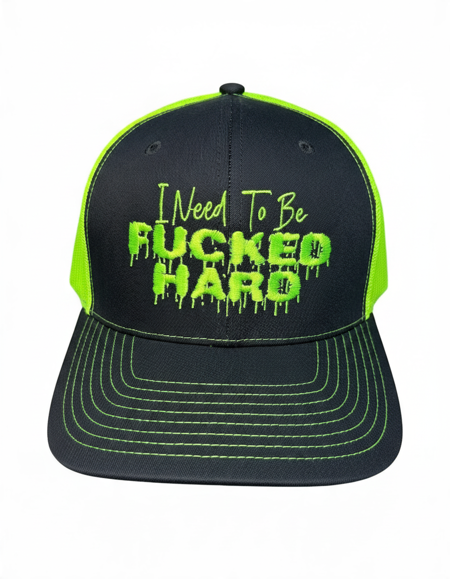 Dirty Merch Apparel charcoal and neon green trucker hat with bold embroidered text on the front panel.