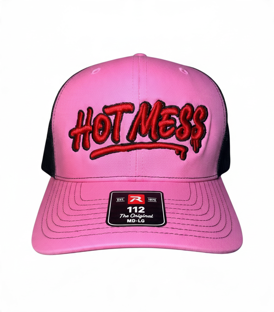 Dirty Merch Apparel pink and black trucker hat with red graffiti-style HOT MESS embroidery and snapback closure