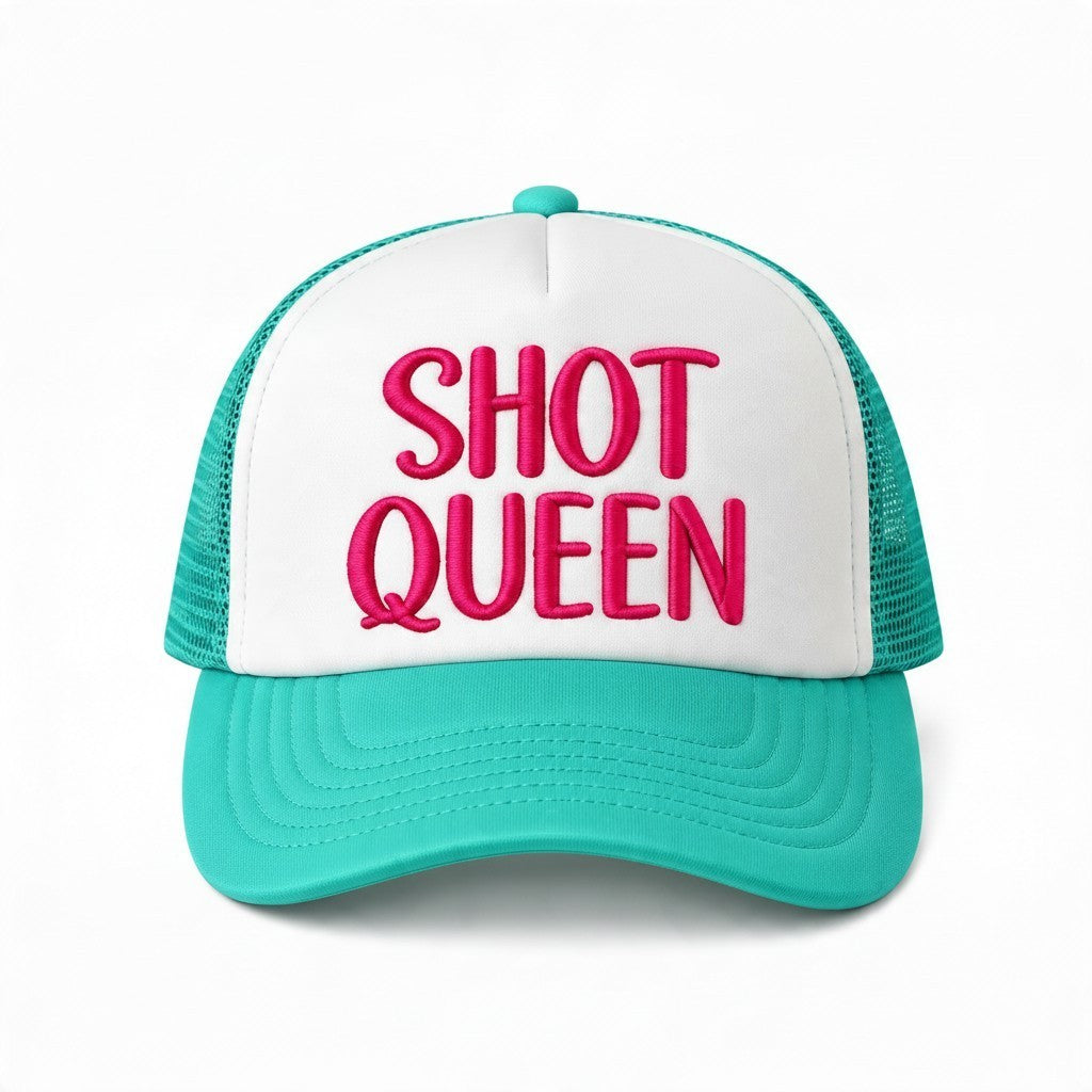 Dirty Merch Apparel Shot Queen trucker hat with white foam front, teal mesh back, and pink embroidered text.
