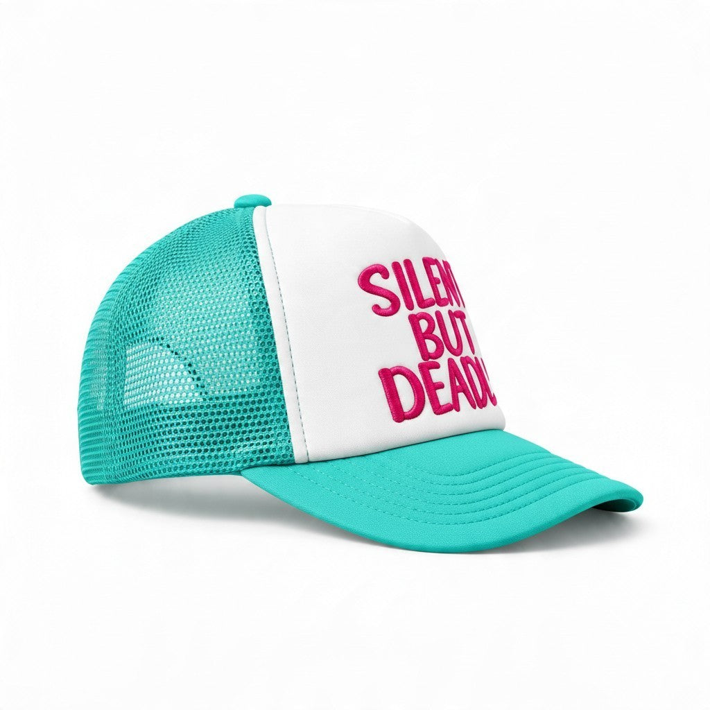 Dirty Merch Apparel trucker hat with white front panel, teal mesh back, and pink embroidered Silent But Deadly text