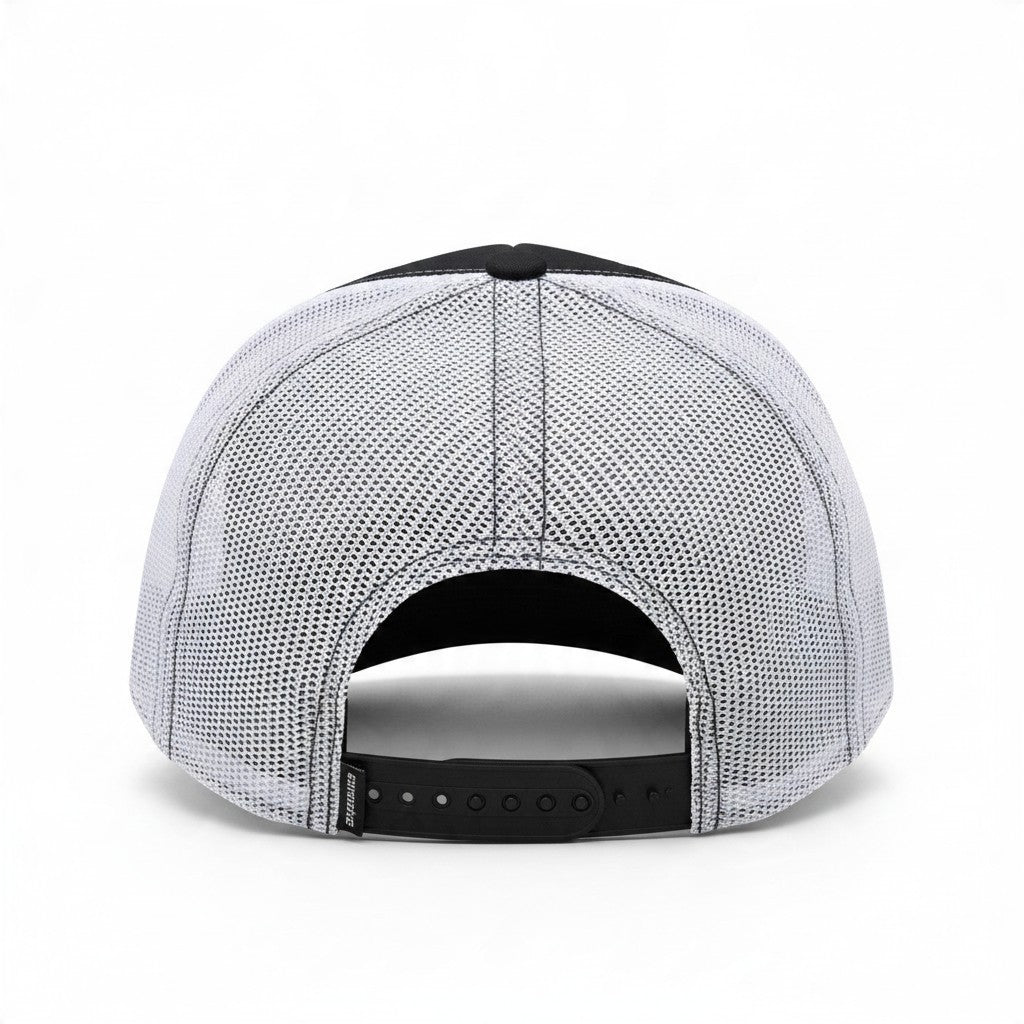 Dirty Merch Apparel trucker hat with a black front panel and white mesh back, featuring an adjustable snapback closure.